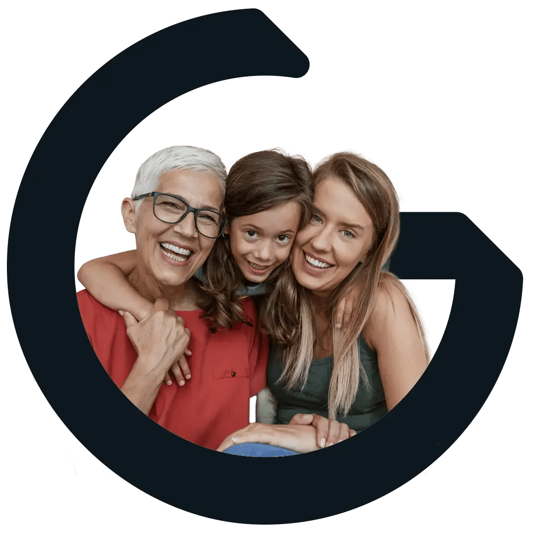 Grandmother, daughter, and granddaughter smiling and looking forward.