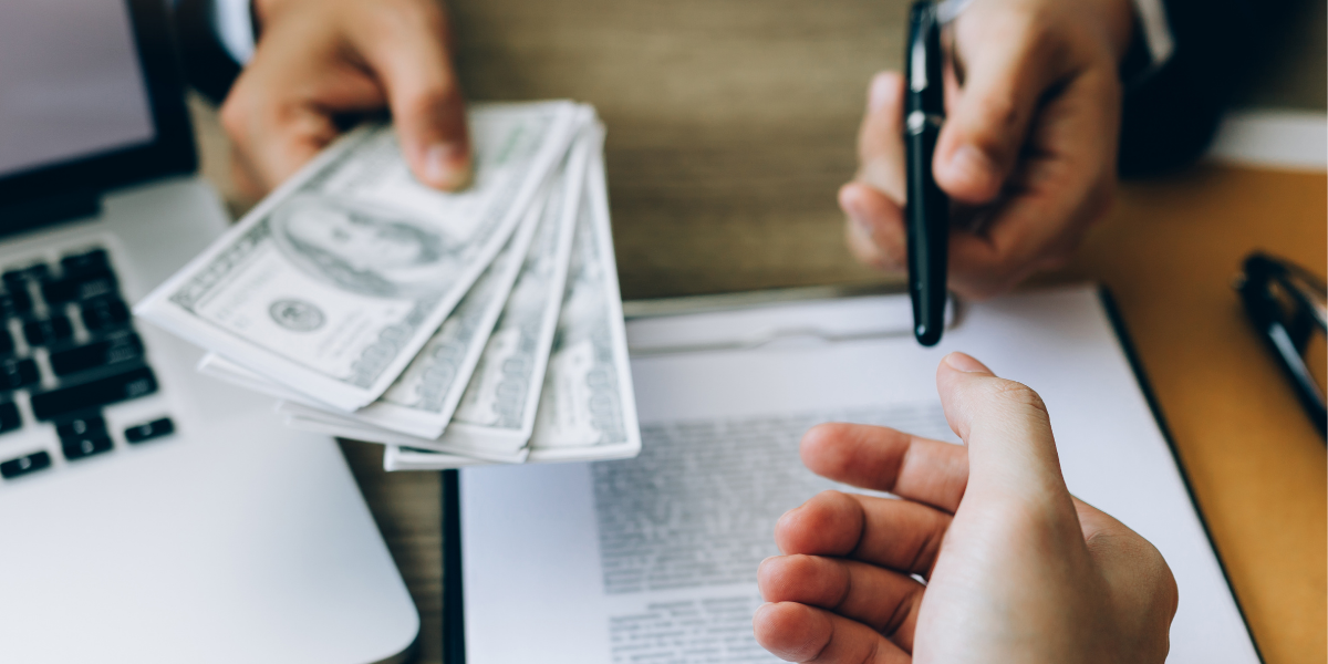 Person signing paperwork to receive an inheritance.
