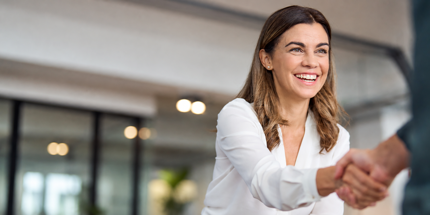 Woman receiving a promotion at her work.